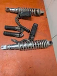 1981 Honda CM400E Front Rear Foot Rests Pegs Steps Shocks Pair 50630-447-730 Used. Price: $64.99.