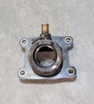 Yamaha YZ80 Intake Manifold Carburetor Boot Joint Holder Insulator 1986-1992 Used. Price: $26.00.